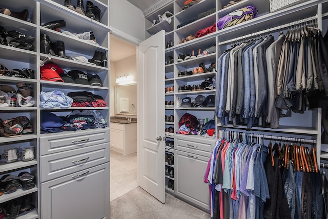 13326 Hartford Bay Trl, Cypress, TX 77429 - spacious closet featuring light tile patterned flooring and light carpet