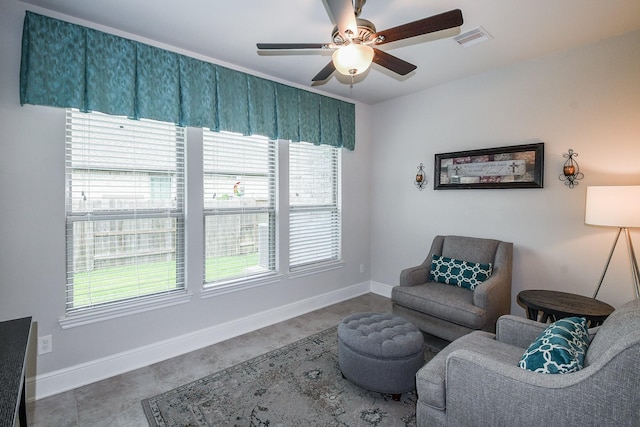 13326 Hartford Bay Trl, Cypress, TX 77429 - living area with a ceiling fan and concrete floors