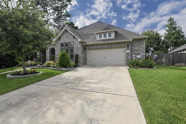 13326 Hartford Bay Trl, Cypress, TX 77429 - view of front of house with concrete driveway, brick siding, a shingled roof, and a garage