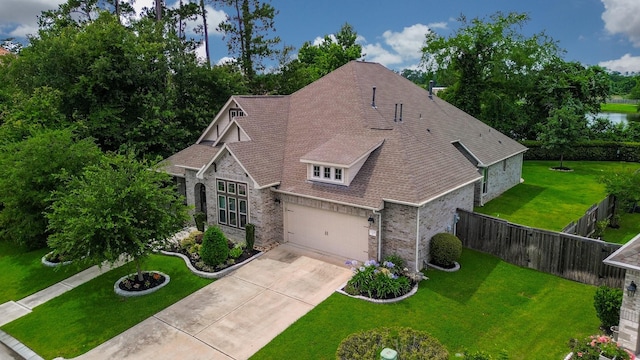 13326 Hartford Bay Trl, Cypress, TX 77429 - view of front of home with brick siding, driveway, roof with shingles, and an attached garage