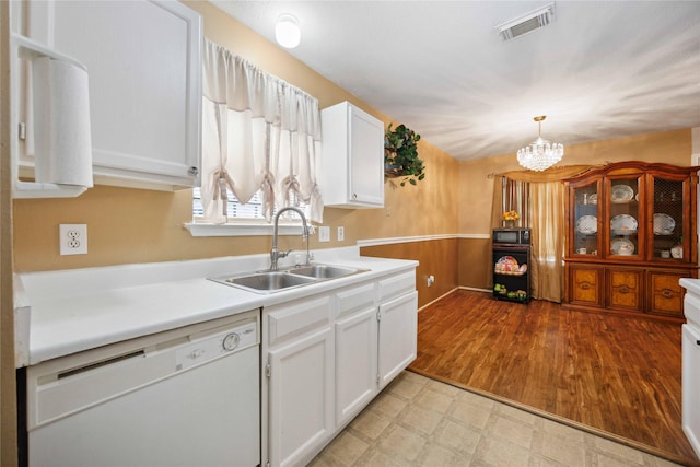 8202 Caddo Rd, Houston, TX 77078 - kitchen featuring dishwasher, black microwave, white cabinetry, light countertops, and light floors