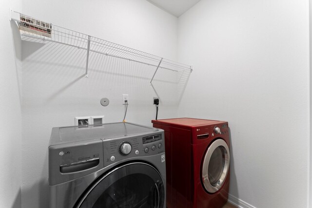 20730 Solstice Point Dr, Hockley, TX 77447 - laundry room with separate washer and dryer and baseboards