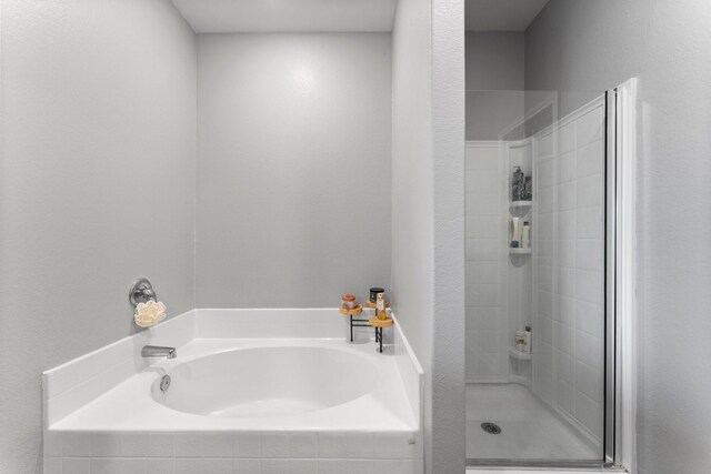 20730 Solstice Point Dr, Hockley, TX 77447 - bathroom with a bath and a stall shower