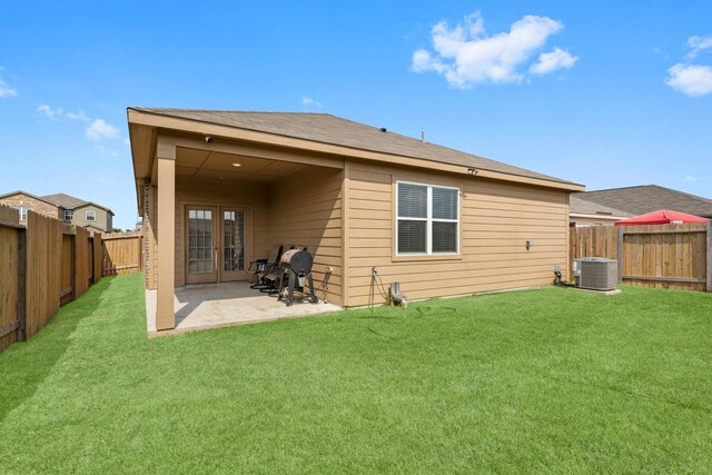 20730 Solstice Point Dr, Hockley, TX 77447 - rear view of property with french doors, cooling unit, and a patio