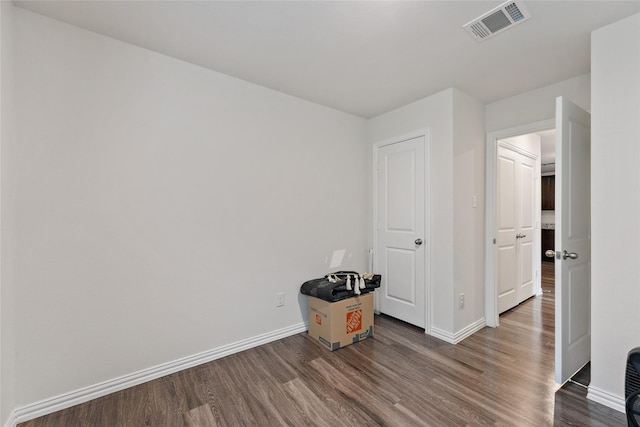 302 Connecticut St, Houston, TX 77029 - unfurnished bedroom featuring dark wood-style floors and baseboards