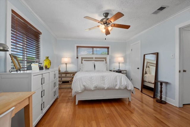 8307 Parasol Ln, Houston, TX 77064 - bedroom with light wood-type flooring, ornamental molding, a textured ceiling, and ceiling fan