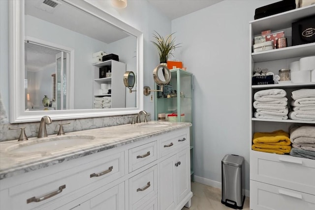 8307 Parasol Ln, Houston, TX 77064 - full bath with double vanity and marble look tile flooring