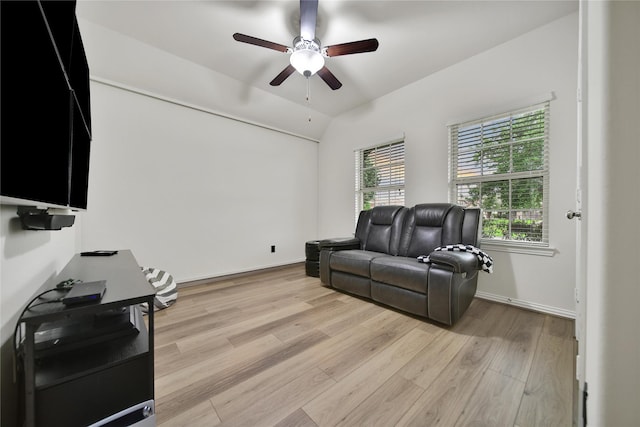 7411 Nottington Ct, Spring, TX 77379 - living area featuring a ceiling fan, light wood-style floors, and vaulted ceiling