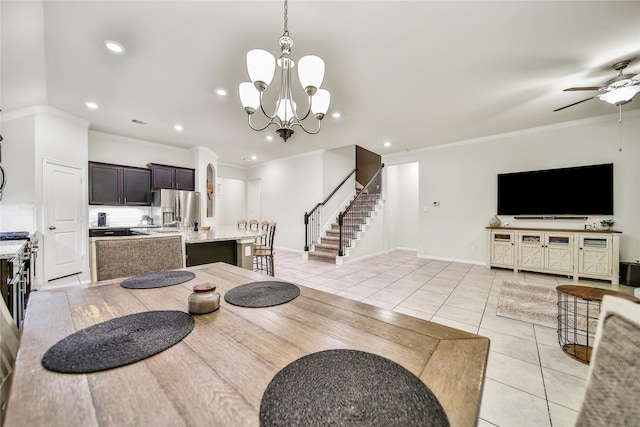 7411 Nottington Ct, Spring, TX 77379 - dining space featuring stairs, light tile patterned floors, ornamental molding, a ceiling fan, and a chandelier