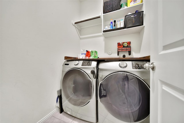 7411 Nottington Ct, Spring, TX 77379 - washroom with washer and dryer and light tile patterned flooring