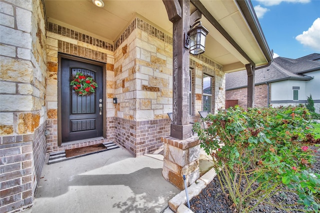 7411 Nottington Ct, Spring, TX 77379 - entrance to property with a porch and stone siding