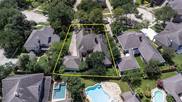 2107 Enchanted Lake Dr, League City, TX 77573 - aerial view of residential area featuring a pool and property boundaries highlighted