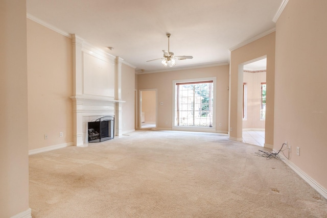 2107 Enchanted Lake Dr, League City, TX 77573 - unfurnished living room with light carpet, a fireplace, ceiling fan, ornamental molding, and baseboards