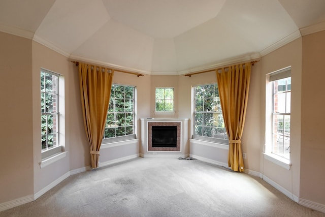 2107 Enchanted Lake Dr, League City, TX 77573 - unfurnished living room featuring carpet flooring, a tiled fireplace, plenty of natural light, crown molding, and baseboards