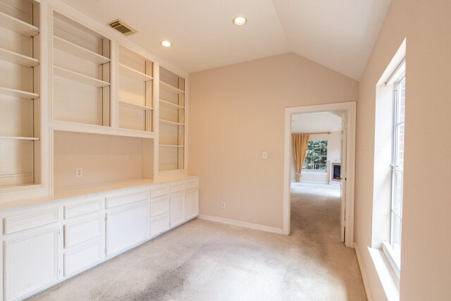 2107 Enchanted Lake Dr, League City, TX 77573 - empty room with light colored carpet, lofted ceiling, baseboards, and recessed lighting