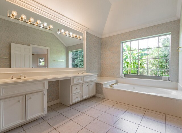 2107 Enchanted Lake Dr, League City, TX 77573 - full bathroom featuring vaulted ceiling, wallpapered walls, double vanity, healthy amount of natural light, and a bath