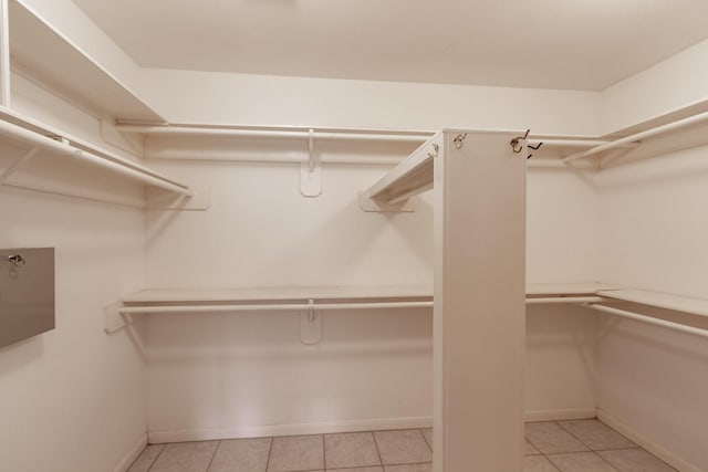 2107 Enchanted Lake Dr, League City, TX 77573 - spacious closet featuring light tile patterned flooring