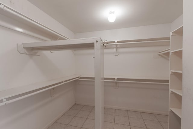 2107 Enchanted Lake Dr, League City, TX 77573 - spacious closet featuring light tile patterned flooring