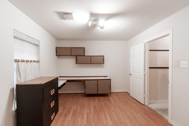 2107 Enchanted Lake Dr, League City, TX 77573 - unfurnished office featuring light wood-type flooring and baseboards