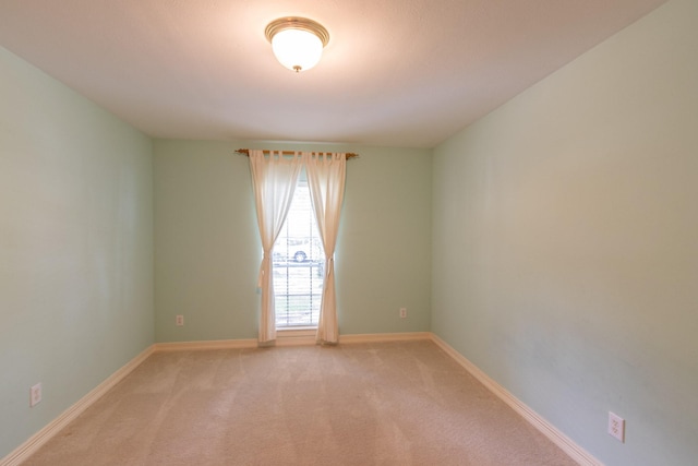 2107 Enchanted Lake Dr, League City, TX 77573 - unfurnished room featuring light carpet and baseboards