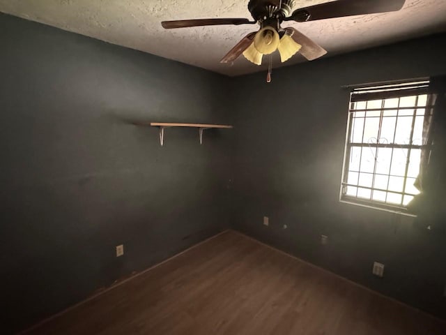 710 Fields St, Richmond, TX 77469 - empty room with wood finished floors, ceiling fan, and a textured ceiling