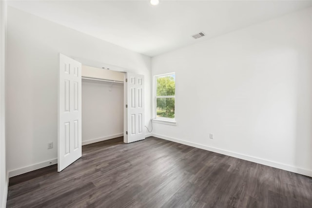 5608 Hollow Pines Dr, Houston, TX 77049 - unfurnished bedroom with dark wood-type flooring, a closet, and recessed lighting