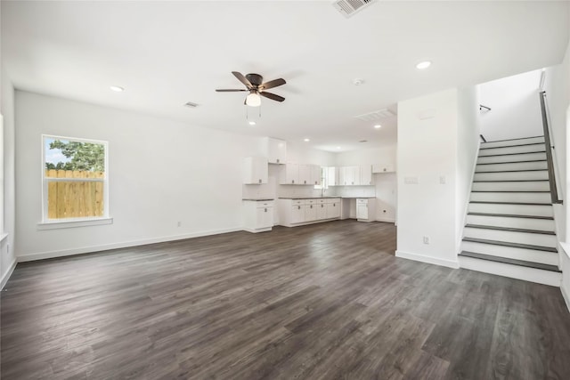 5608 Hollow Pines Dr, Houston, TX 77049 - unfurnished living room featuring ceiling fan, dark wood finished floors, recessed lighting, stairway, and baseboards