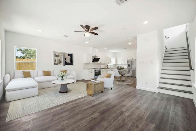 5608 Hollow Pines Dr, Houston, TX 77049 - living area featuring stairs, wood finished floors, ceiling fan, and recessed lighting