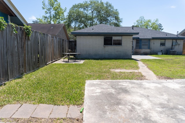 702 Meadowglen Dr, Baytown, TX 77521 - back of house featuring a patio and brick siding