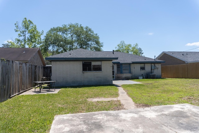 702 Meadowglen Dr, Baytown, TX 77521 - back of house featuring a patio, brick siding, and a fenced backyard