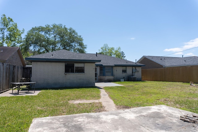 702 Meadowglen Dr, Baytown, TX 77521 - back of house with a patio, brick siding, and a fenced backyard