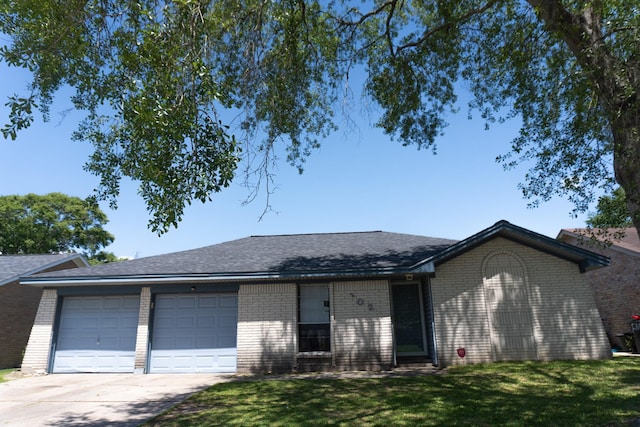 702 Meadowglen Dr, Baytown, TX 77521 - single story home featuring a garage, driveway, brick siding, and a front lawn