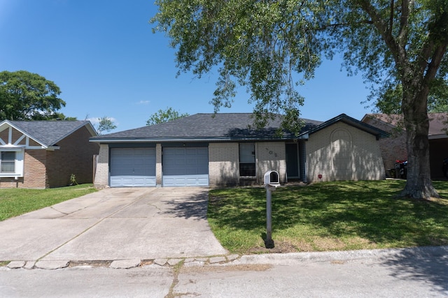 702 Meadowglen Dr, Baytown, TX 77521 - single story home with brick siding, a garage, concrete driveway, and a front yard