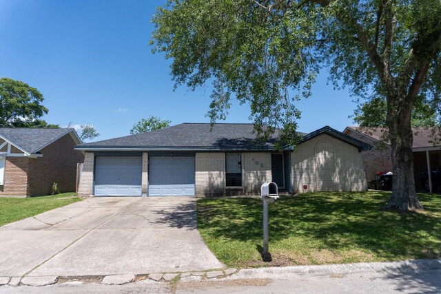 702 Meadowglen Dr, Baytown, TX 77521 - ranch-style home featuring brick siding, an attached garage, concrete driveway, and a front yard