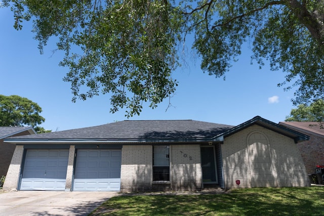 702 Meadowglen Dr, Baytown, TX 77521 - single story home with brick siding, concrete driveway, a garage, a front yard, and a shingled roof