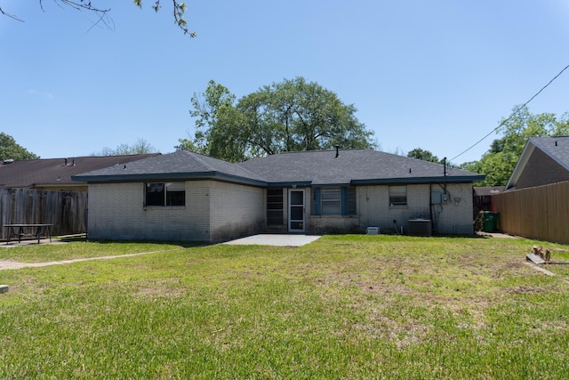 702 Meadowglen Dr, Baytown, TX 77521 - rear view of property featuring brick siding and a patio