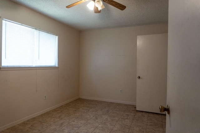 702 Meadowglen Dr, Baytown, TX 77521 - unfurnished room with a ceiling fan, a textured ceiling, and light tile patterned flooring