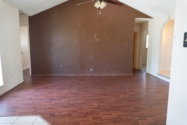 702 Meadowglen Dr, Baytown, TX 77521 - spare room featuring arched walkways, ceiling fan, wood finished floors, and lofted ceiling