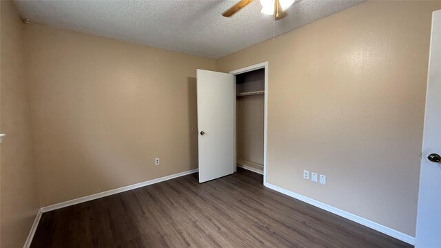 702 Meadowglen Dr, Baytown, TX 77521 - unfurnished bedroom with dark wood-style floors, a textured ceiling, a closet, and ceiling fan