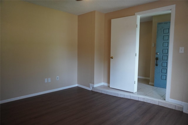 702 Meadowglen Dr, Baytown, TX 77521 - spare room featuring wood finished floors and baseboards