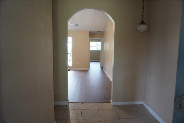 702 Meadowglen Dr, Baytown, TX 77521 - hallway featuring arched walkways and tile patterned floors