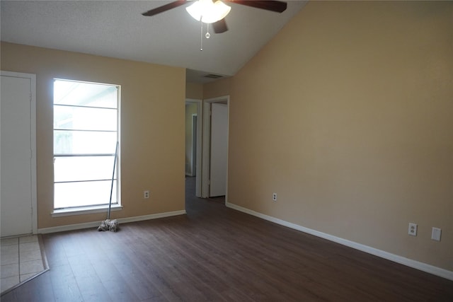 702 Meadowglen Dr, Baytown, TX 77521 - unfurnished room featuring ceiling fan, dark wood-style floors, and vaulted ceiling