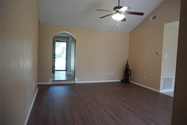 702 Meadowglen Dr, Baytown, TX 77521 - spare room with vaulted ceiling, ceiling fan, wood finished floors, and arched walkways