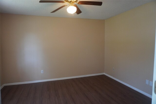 702 Meadowglen Dr, Baytown, TX 77521 - unfurnished room featuring dark wood-style flooring, a ceiling fan, and a textured ceiling