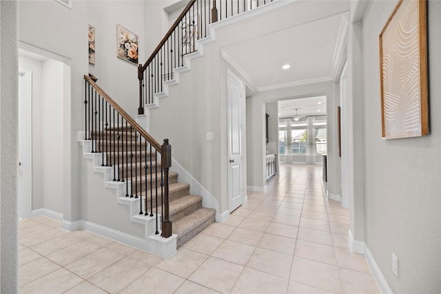 3507 Canyon Branch Ln, Fulshear, TX 77441 - entryway featuring light tile patterned floors, ornamental molding, stairway, and baseboards