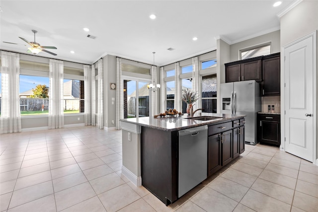 3507 Canyon Branch Ln, Fulshear, TX 77441 - kitchen featuring appliances with stainless steel finishes, crown molding, a sink, light tile patterned floors, and stone counters