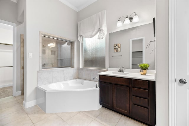 3507 Canyon Branch Ln, Fulshear, TX 77441 - bathroom with a spacious closet, a garden tub, vanity, ornamental molding, and a tile shower