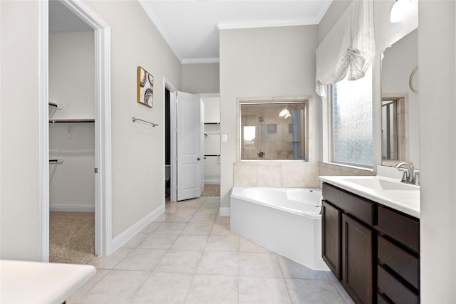 3507 Canyon Branch Ln, Fulshear, TX 77441 - bathroom featuring a bath, vanity, a walk in closet, ornamental molding, and tile patterned floors