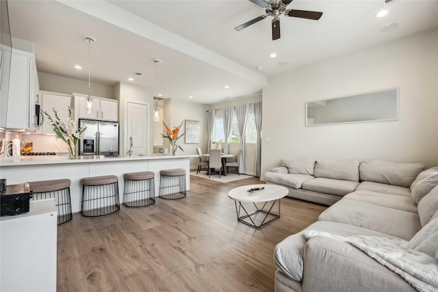 9504 Retriever Way, Houston, TX 77055 - living area featuring light wood-style floors, ceiling fan, and recessed lighting