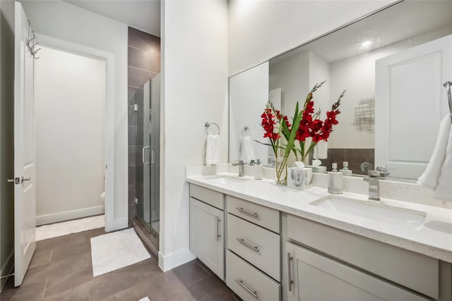 9504 Retriever Way, Houston, TX 77055 - bathroom with double vanity, a stall shower, baseboards, and toilet